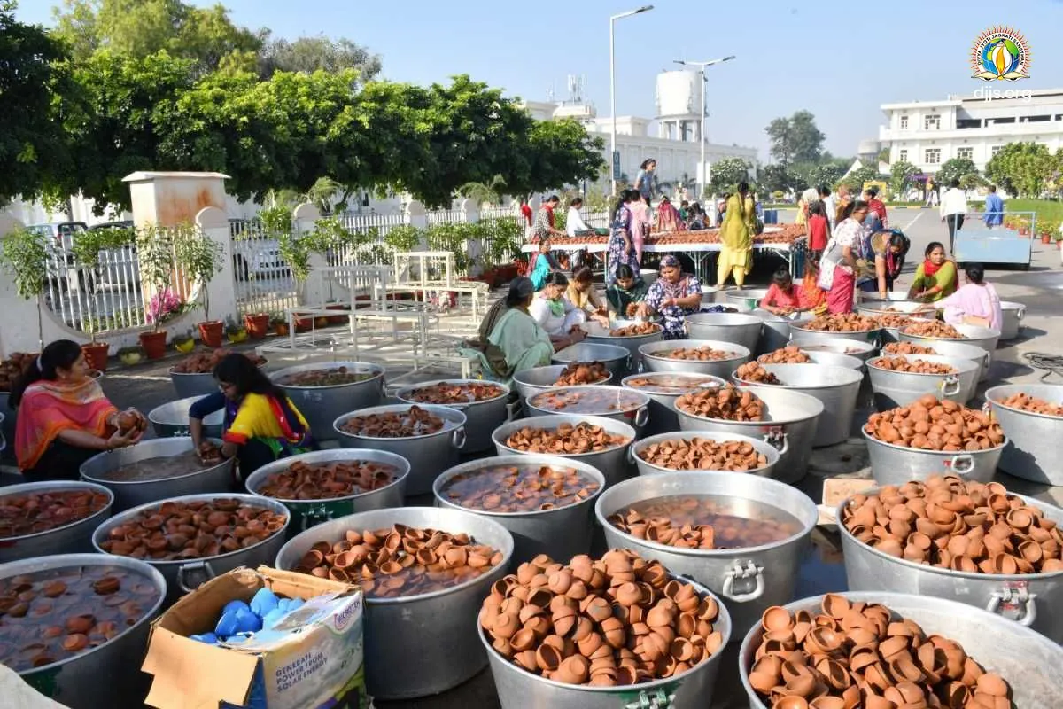 Vessels filled with handmade earthen lamps prepared in the grounds of Nurmahal Ashram before Green Diwali 2022